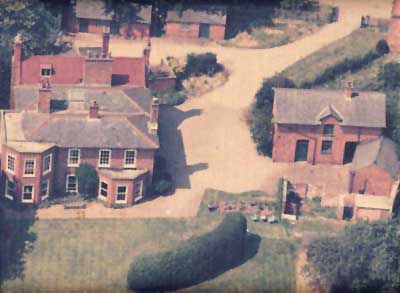 Aerial photograph of the Old Rectory, Stables and Coach House before
              conversion circa 1986